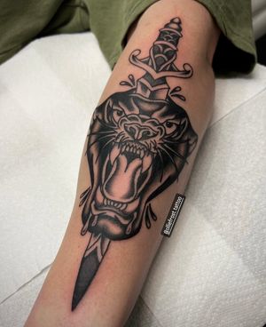 Black and grey panther and dagger