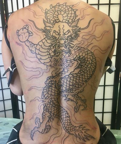 Experience the power and majesty of a Japanese dragon in this stunning blackwork illustration by Kiko Lopes.