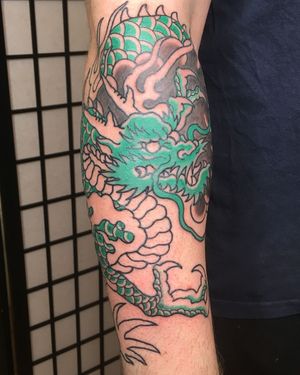 Intricate and bold illustrative dragon design by Kiko Lopes, perfect for forearm placement.