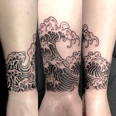 Elegantly crafted by Matthew Ono, this black and gray fine line tattoo captures the beauty of the sea with intricate Japanese waves motif.