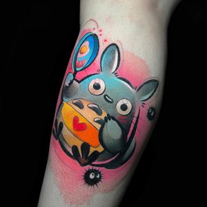 Get inked with a colorful lower leg tattoo featuring a heart, paw, and sweet treats by Cloto.tattoos!
