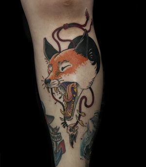 Get inked with a striking neo traditional design featuring a fox and skull by tattoo artist Luca Salzano on your lower leg.