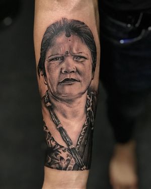 Stunning black and gray forearm tattoo of a woman, beautifully illustrated by Avi. Perfect blend of realism and artistry.