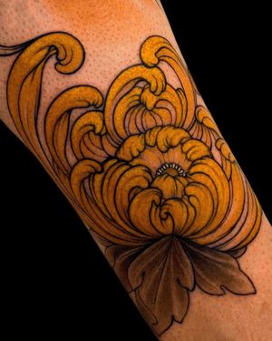 Beautifully intricate flower design by Edyta, perfect for a bold statement on your forearm.
