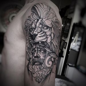 Capture the intensity of lion and man with intricate dotwork and black & gray shading by Lamat. Perfect for upper arm placement.
