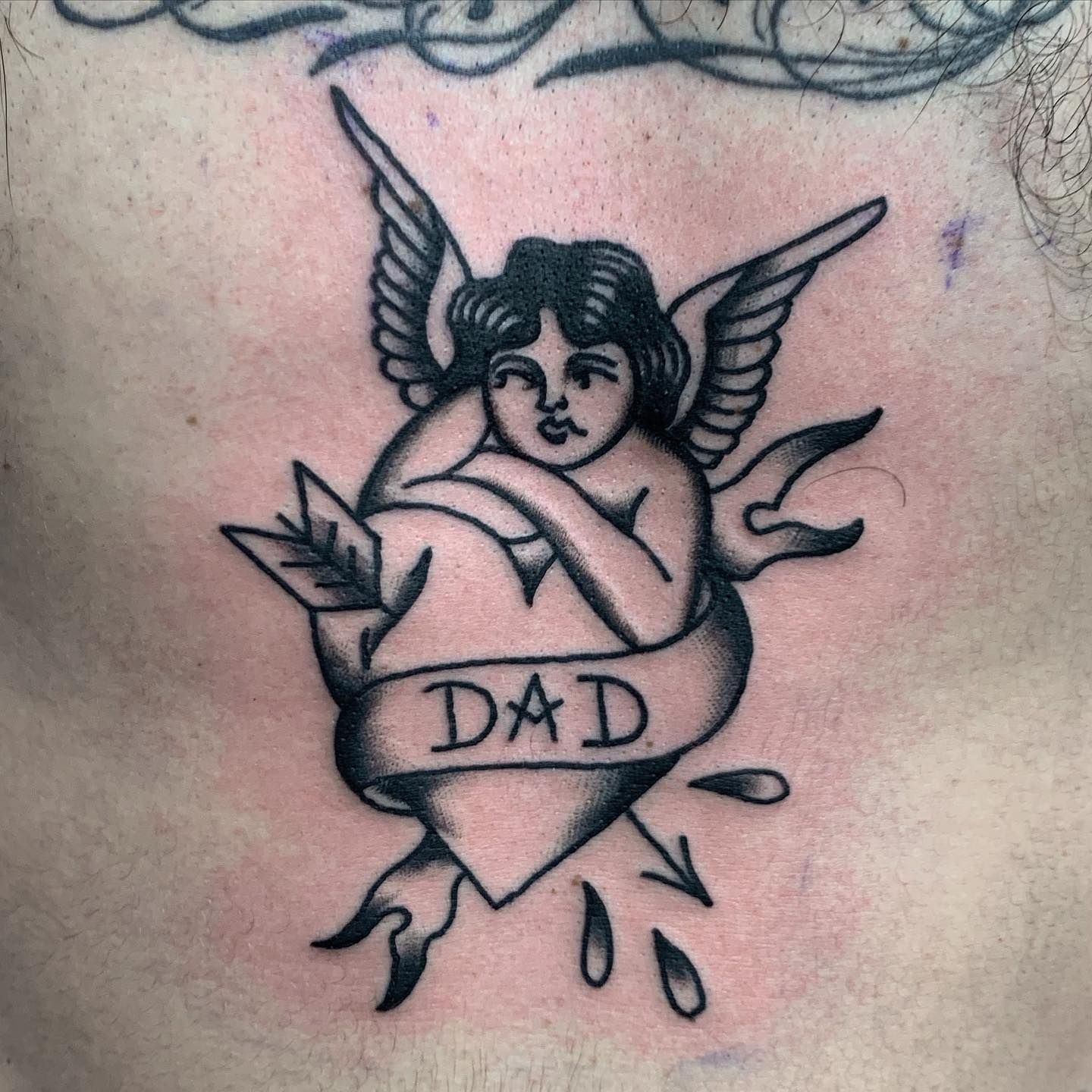 angel symbol tattoo
