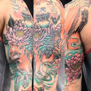 Matthew Ono's stunning tattoo featuring a mix of fierce scorpion, cunning fox, and delicate flower motifs in neo-traditional style.