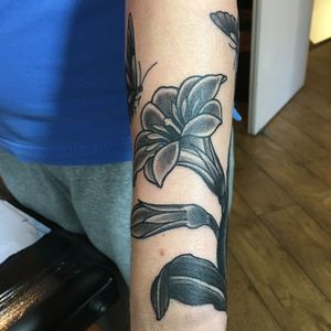 Get a stunning blackwork floral design by Kiko Lopes on your forearm for a unique and bold look.