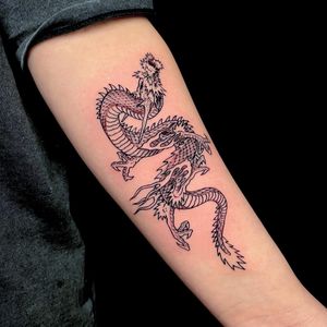 Experience the power and beauty of a traditional Japanese dragon tattoo by talented artist Fernando Joergensen.