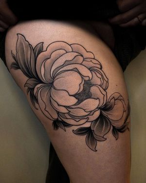Elegant and delicate, this floral tattoo by Edyta features intricate fine line details, perfect for the upper leg placement.