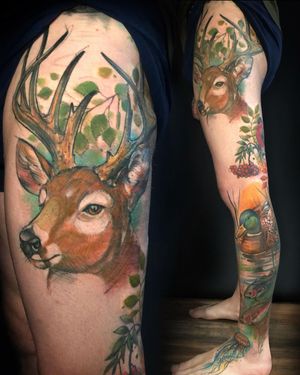 Illustrative tattoo of a majestic deer in vibrant watercolor style, beautifully done by artist Aygul on the knee.