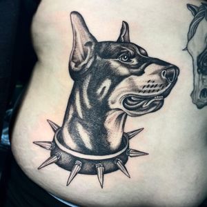 Experience the lifelike detail of a dog tattoo on your stomach by Letitia Mortimer with this stunning black and gray design.
