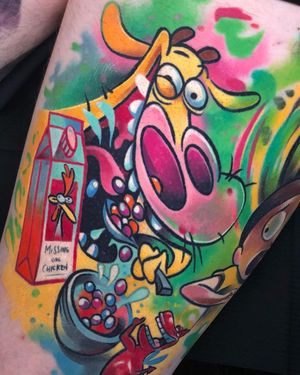 Adorable upper leg tattoo featuring a cow, milk, cereal, candy and a spoon in a new school anime style by Cloto.tattoos.