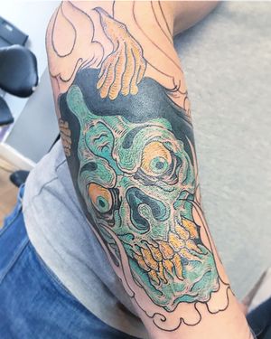 Vibrant new school style skull design on forearm, expertly executed by talented artist Matthew Ono.
