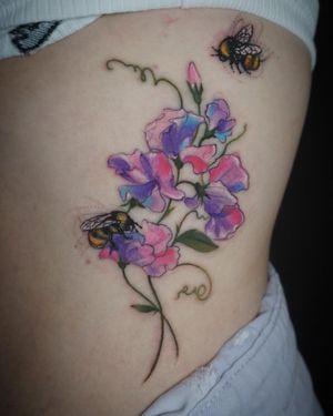 Beautiful bee and flower design on the ribs, expertly executed in watercolor style by the talented artist Aygul.