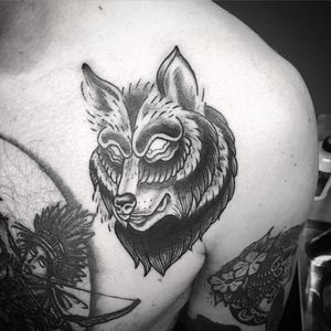 Experience the power and beauty of the wolf with this stunning black and gray chest tattoo by Matthew Ono.