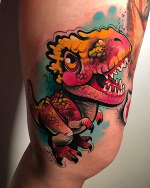 Get a unique and colorful dino tattoo by Cloto.tattoos in an illustrative watercolor style on your upper leg.