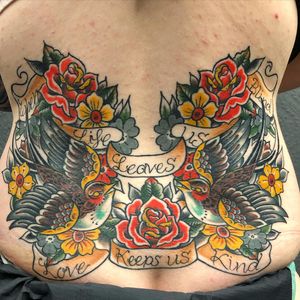 Beautiful traditional back tattoo featuring a bird, flower, and meaningful quote by Matthew Ono.