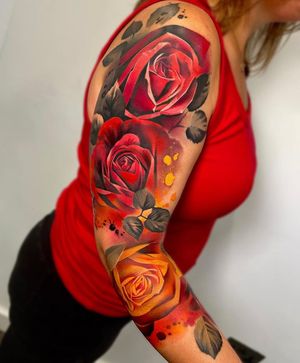 Experience the beauty of a realistic floral sleeve tattoo with intricate details and vibrant colors by the talented artist Cloto.tattoos.