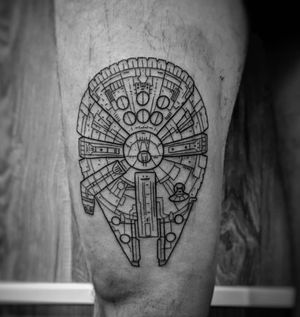 Unique fine line design of a spaceship inspired by the millennium falcon, on the upper leg by artist Luca Salzano.