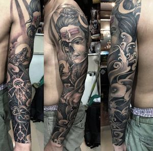 A stunning illustrative sleeve featuring a snake, flower, woman, eye, and intricate filigree patterns, all expertly done in black and gray by Avi.