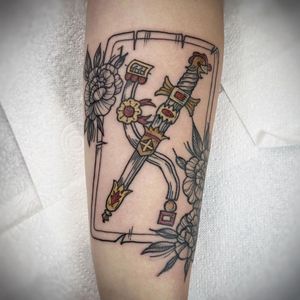 Express your strength and beauty with this unique new school tattoo of a flower and sword by the talented artist Lamat.
