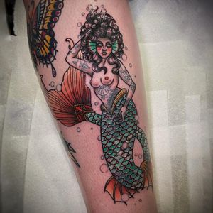 Get inked with this stunning new school Japanese mermaid design on your forearm by artist Lamat.