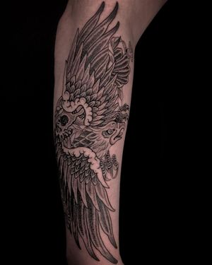 Stunning black and gray design by Matthew Ono, featuring a powerful eagle and skull motif.