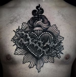 Marvel at the detailed dotwork design of a heart and cross intertwined with thorns by the talented Lamat.