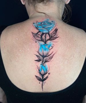 Beautiful black and gray watercolor flower tattoo delicately inked by Fernando Joergensen on the upper back.