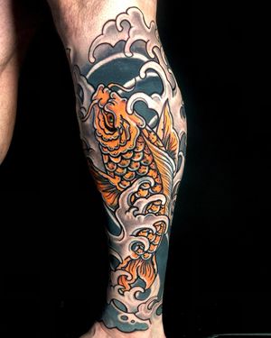 Get a stunning Japanese koi fish tattoo on your shin, featuring intricate waves by talented artist Matthew Ono.