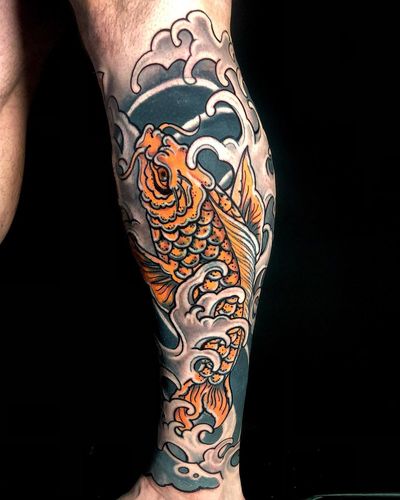 Get a stunning Japanese koi fish tattoo on your shin, featuring intricate waves by talented artist Matthew Ono.