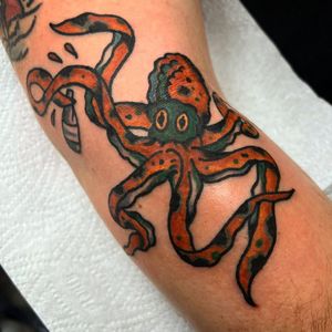 Get inked by Alessandro Lanzafame with this classic octopus design for a timeless look on your arm. Embrace the sea creature's symbolism of intelligence and adaptability.