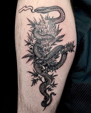 Stunning Japanese dragon tattoo by Fernando Joergensen on lower leg, symbolizing strength and power. Perfect for tattoo lovers looking for a bold design.