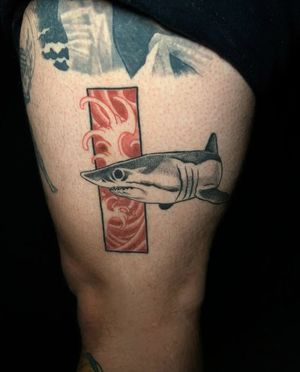 Get a striking Japanese tattoo featuring a fierce shark and crashing waves on your upper leg by the talented artist Luca Salzano.