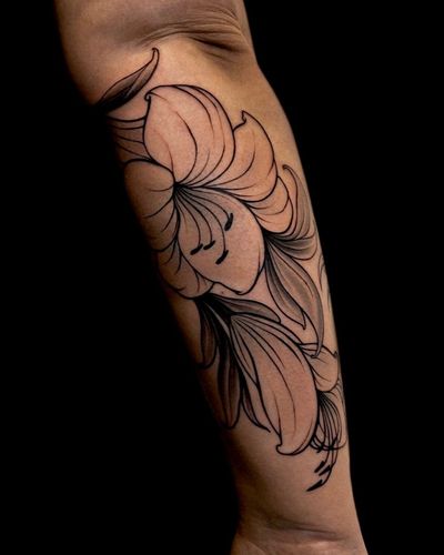 Get a delicate flower design on your forearm with this fine line floral tattoo by talented artist Edyta.