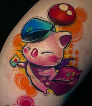 An illustrative upper arm tattoo featuring a cat, heart, cap, and letter, done by Cloto.tattoos. Express your love for felines in a vibrant watercolor style.