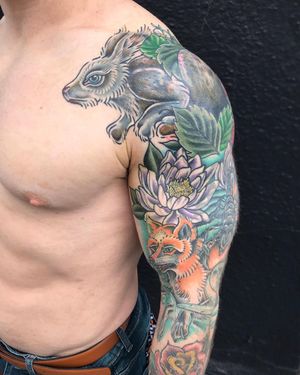 Colorful and detailed neo-traditional sleeve tattoo featuring a scorpion and flower design by Matthew Ono.