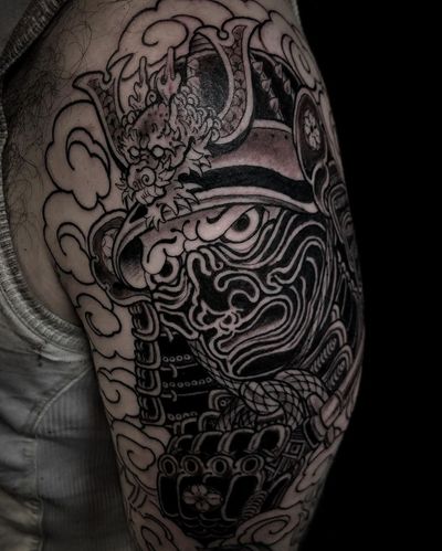 Impressive black and gray design featuring a fierce dragon, samurai warrior, and piercing eyes by talented artist Matthew Ono.