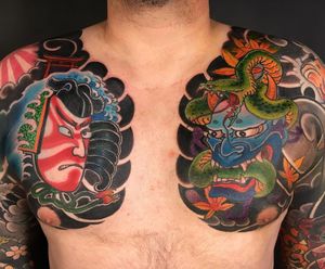 Capture the mystique of Japanese art with this chest tattoo featuring a snake, flower, hannya mask, cloud, and leaf design by artist Kiko Lopes. Bold and illustrative.
