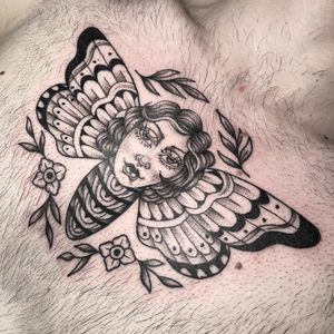 A beautiful combination of black and gray neo-traditional style featuring a graceful woman with butterfly wings on the chest. By Letitia Mortimer.