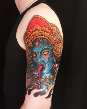 Unique and intricate upper arm tattoo featuring a combination of skull and Kali motifs, expertly done by Fernando Joergensen.