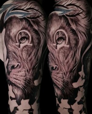 Immerse yourself in the wild with this stunning black and gray lion tattoo by Mauro Imperatori.