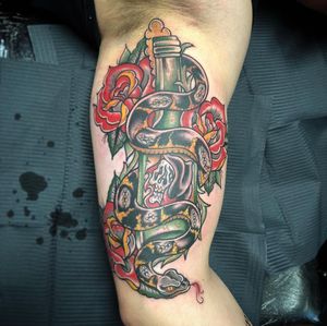 Get inked by Matthew Ono with this vibrant new school design on your upper arm. The perfect mix of beauty and danger.