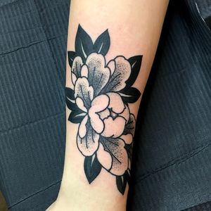 Get stunning illustrative blackwork flower tattoo by artist Kiko Lopes on your forearm. A piece of timeless elegance.