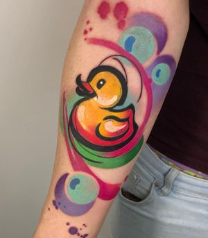 Express your love for ducks with this stunning illustrative watercolor tattoo by Cloto.tattoos. A unique combination of patterns and colors.