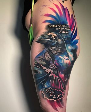Express your inner universe with a stunning watercolor galaxy raven tattoo on your upper leg. Featuring a mystical bird, stars, and a meaningful quote. By Cloto.tattoos.