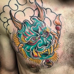 Get a stunning Japanese dragon chest tattoo by Matthew Ono, blending traditional style and fierce symbolism.