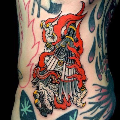 Experience the fierce and legendary oni demon in traditional Japanese style inked expertly on your ribs by artist Matthew Ono.