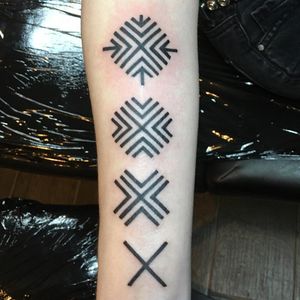 Get a stunning blackwork, ornamental, and illustrative tribal pattern tattoo on your forearm by Kiko Lopes.